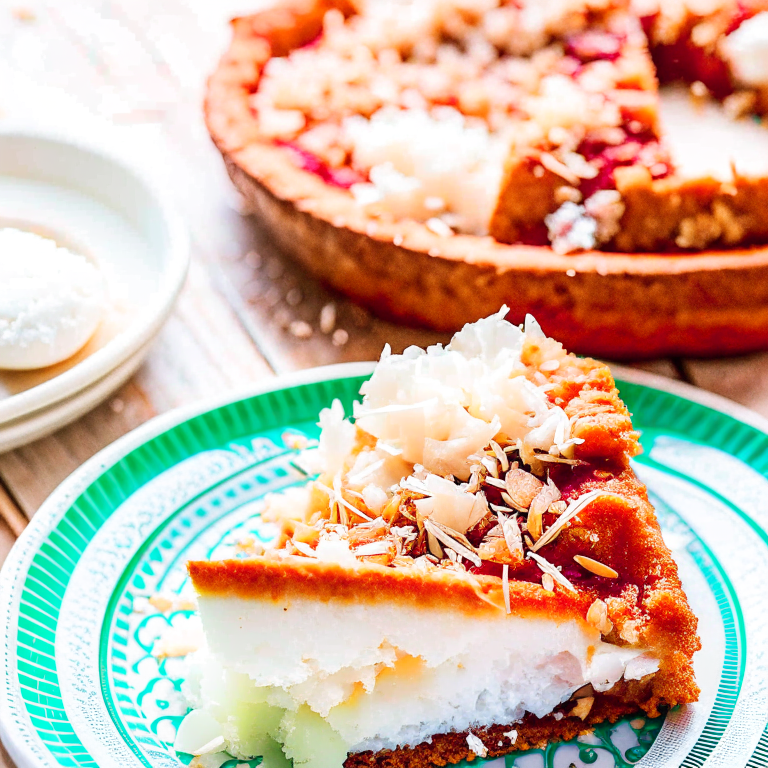 a slice of heavenly coconut cream pie, with a toasted coconut topping and a flaky crust. 