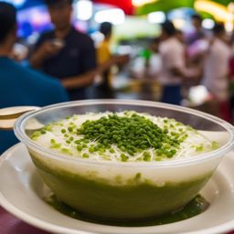 cendol, a southeast asian dessert, devoured at a bustling market in kuala lumpur. 