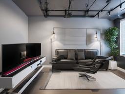 In the gamer room, urban modern interior design features a minimalist gaming setup, comfortable seating, and industrial accents that create an engaging environment for gaming.  