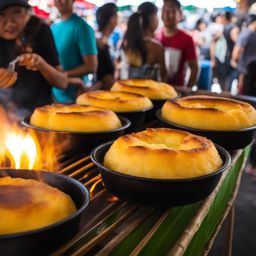 bibingka, a filipino rice cake, enjoyed at a lively street food festival in manila. 