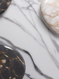 Marble with a river pebble-like appearance and a glossy surface top view, product photoshoot realistic background, hyper detail, high resolution