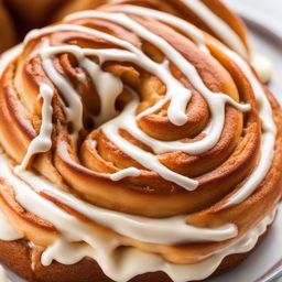 a warm and gooey cinnamon roll, swirled with cinnamon and covered in cream cheese icing. 